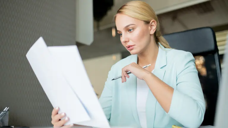 young lady with papers for services