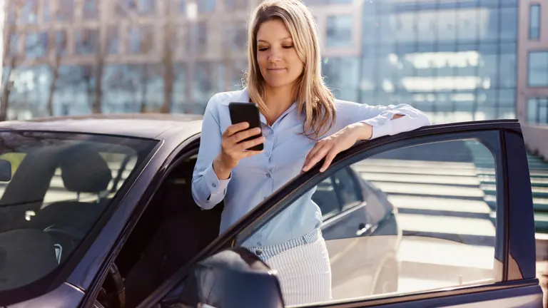 woman with car and mobile