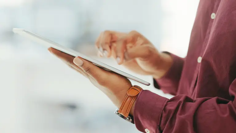 A person holding a tablet