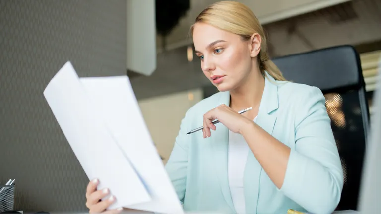 young lady with papers for services